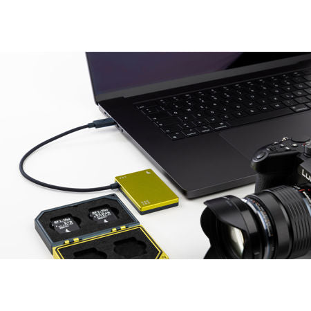 Angelbird SSD2GO PKT MK3 connected to a laptop with camera gear