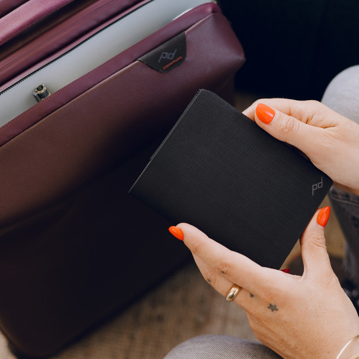 Peak Design Passport Wallet in hand travel lifestyle