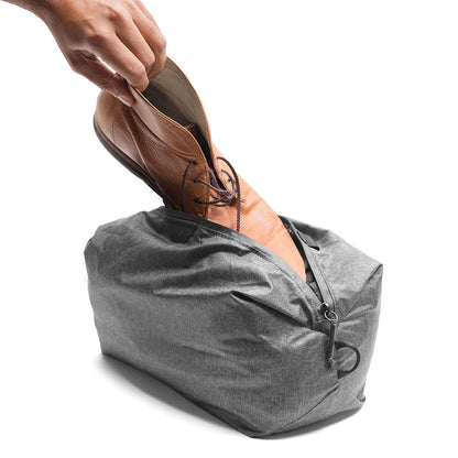 Peak Design Shoe Pouch Charcoal in use with shoes